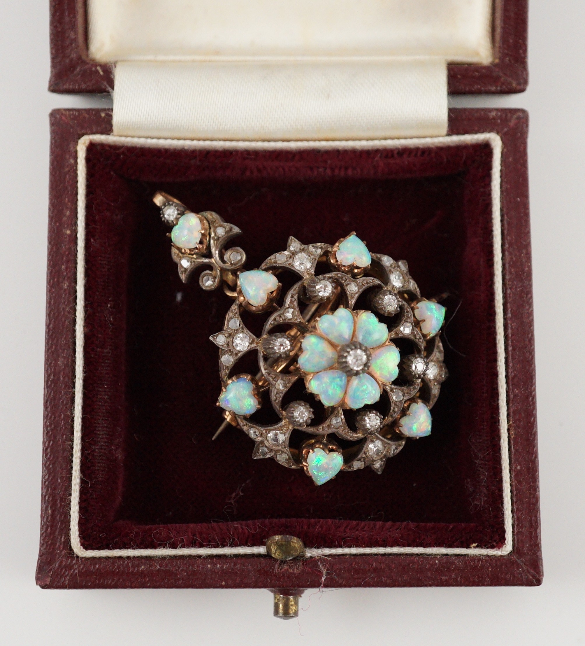 A late Victorian gold silver and diamond circular cluster pendant brooch, 3.5cm, gross 17.5 grams